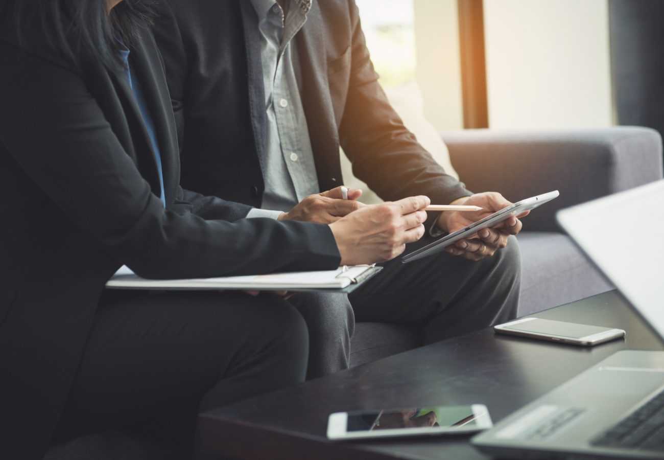 team-work-process-young-business-managers-crew-working-with-new-startup-project-labtop-wood-table-typing-keyboard-texting-message-analyze-graph-plans